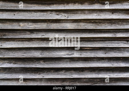 Old weathered horizontal wood exterior siding Stock Photo