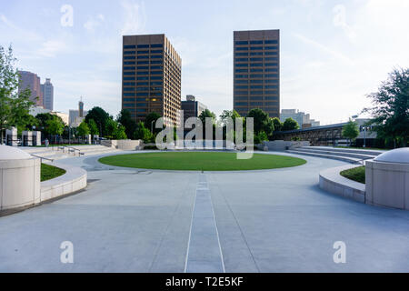 A nice angle of some buildings in a downtown area with a historic capital building in the reflection of the windows Stock Photo