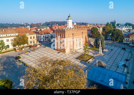 Sandomierz old city, Poland. Aerial view in sunrise light. Gothic city hall with clock tower and Renaissance attic and St Mary statue in the market Sq Stock Photo