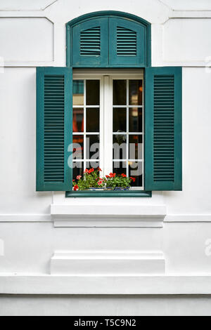 Exterior of light vietnamese house with vintage window Stock Photo