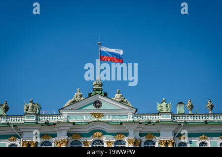 Russian flag waving on the top of Hermitage Museum in Saint Petersburg, Russia - flag of Russian Federation. Stock Photo