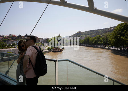 A young couple at the Pease Brigde. Tbilisi. Georgia Stock Photo