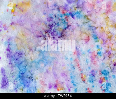 Abstract watercolor background with colorful paint stains and drops in violet, pink, red, blue colors. Hand drawn traditional illustration. Stock Photo