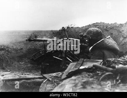 German Soldier firing an MG42 on the Eastern Front 1944 Stock Photo