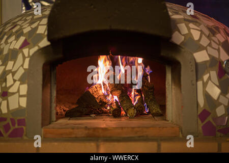 detail view of a newly lit wood oven and ready to put the homemade pizzas Stock Photo