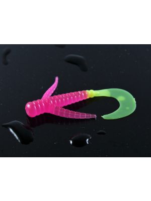 A pink and green fish hook on top of black surface.