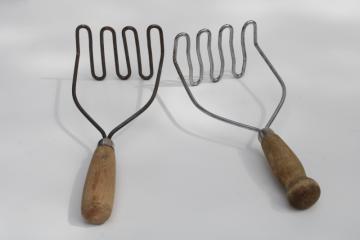 natural worn wood handled potato mashers, old kitchen utensils, 1930s vintage kitchenware