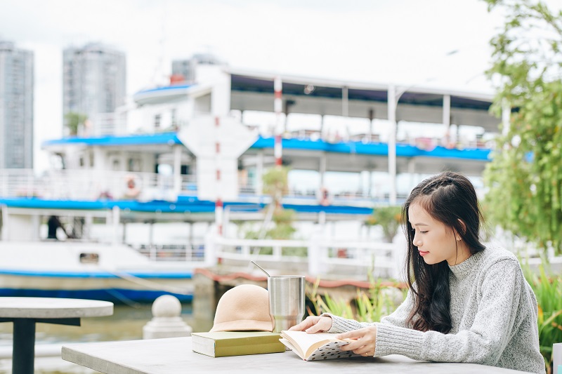 Student sitting at table on campus