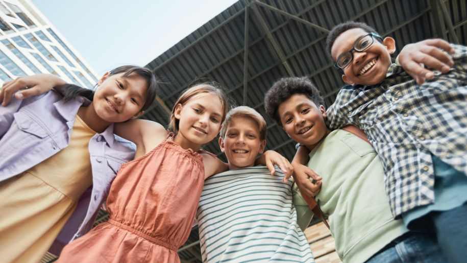 kids standing outside smiling