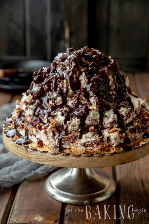 Marble cake topped with chocolate on a glass platter.