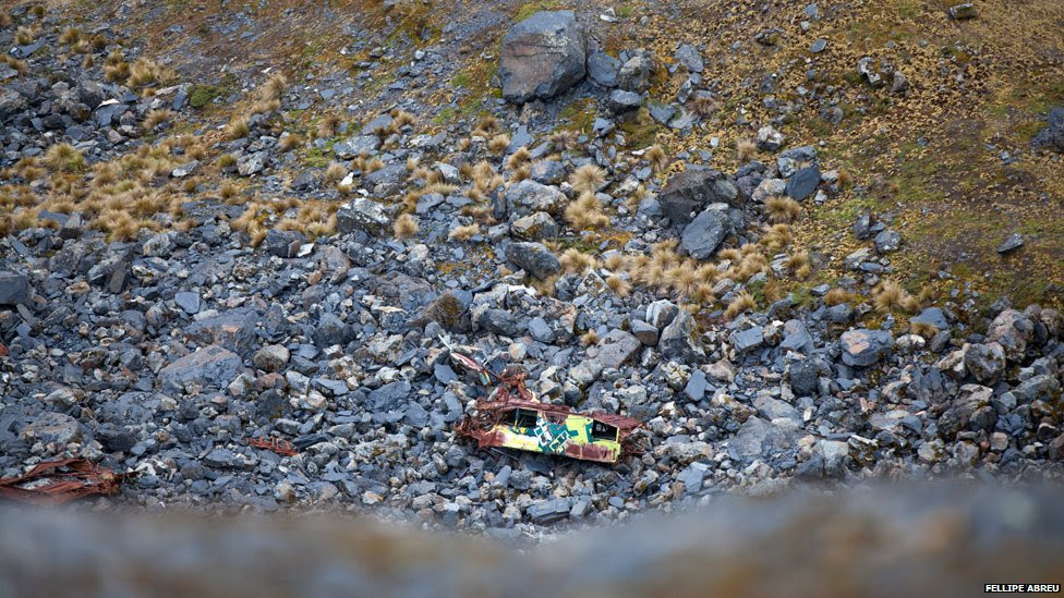 A bus lies in a ravine off the Yungas road on 6 September, 2014