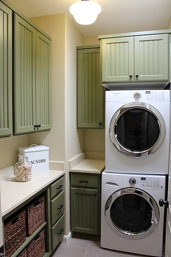 green cabinets in laundry room - Hooked on Houses