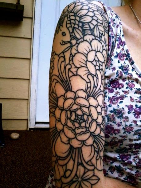 gorgeous black line floral. this particular tattoo is unfinished, but i like the simplicity of the hard lines and the high contrast.