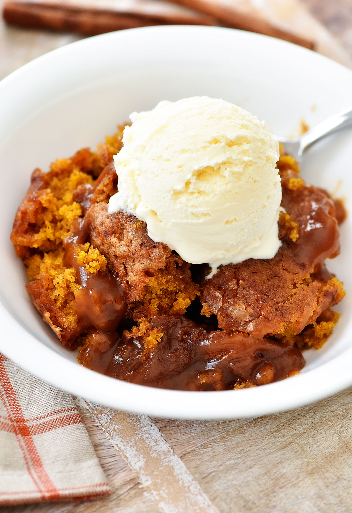 Pumpkin Cobbler is a warm bread-like cake with a gooey pumpkin-caramel sauce below. Life-in-the-Lofthouse.com