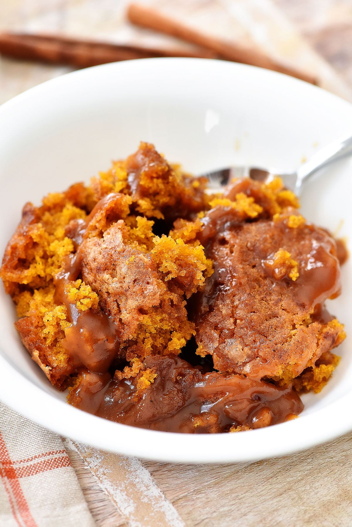 Pumpkin Cobbler is a warm bread-like cake with a gooey pumpkin-caramel sauce below. Life-in-the-Lofthouse.com