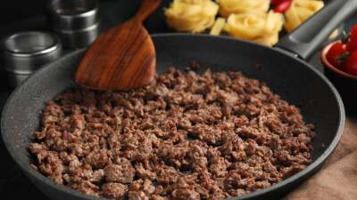 Close-up of a pan of cooked ground meat.