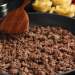 Close-up of a pan of cooked ground meat.