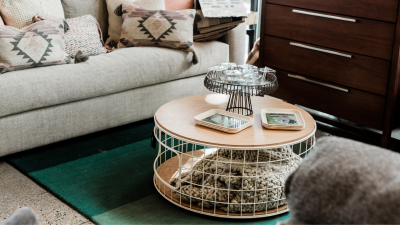 modern living room with a storage ottoman in front of a couch