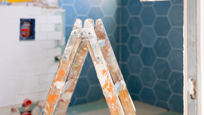 close-up of a ladder with bathroom renovation in background