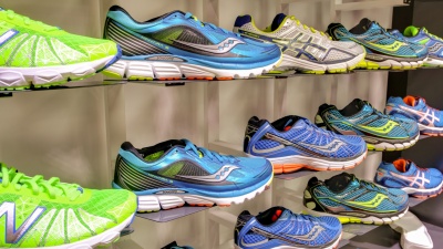 wall of running shoes at store