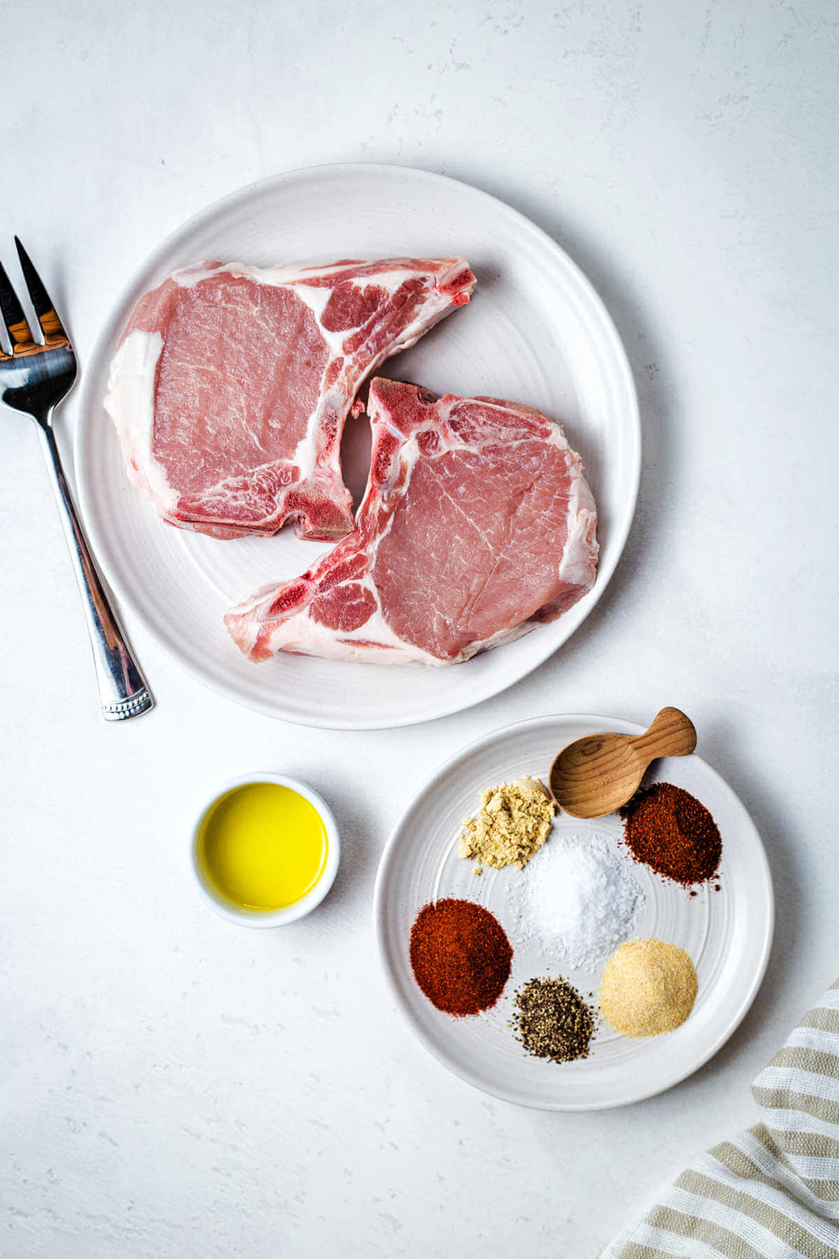 ingredients for air fryer pork chops on a table.