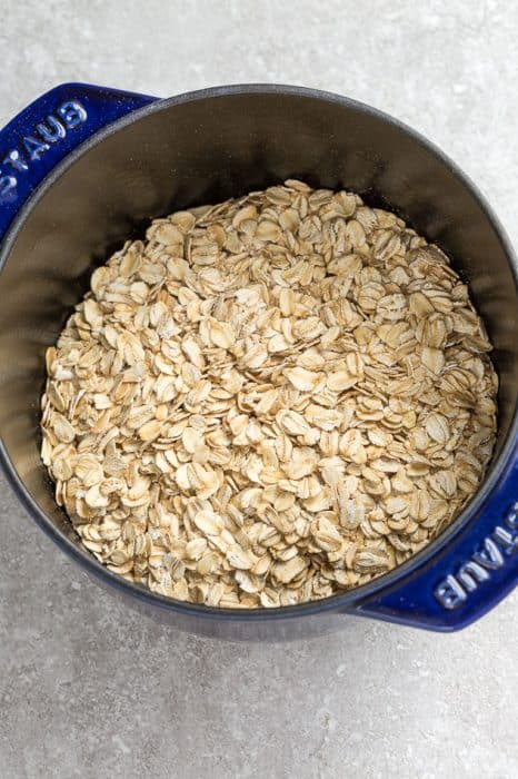 A Silver and Navy Blue Pot Filled with Old-Fashioned Oats