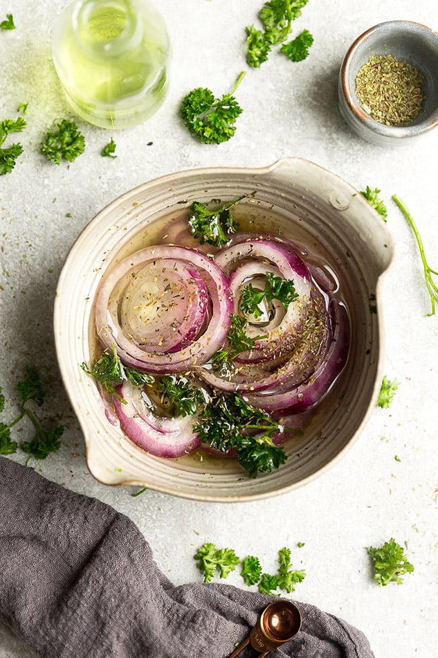 Overhead image of easy pickled red onions with parsley.