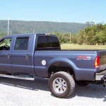 Pick up truck that has been converted into a tow truck with a hidden wheel lift.