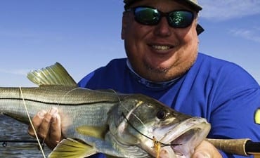 Tampa Area Charter captain holding backcountry snook