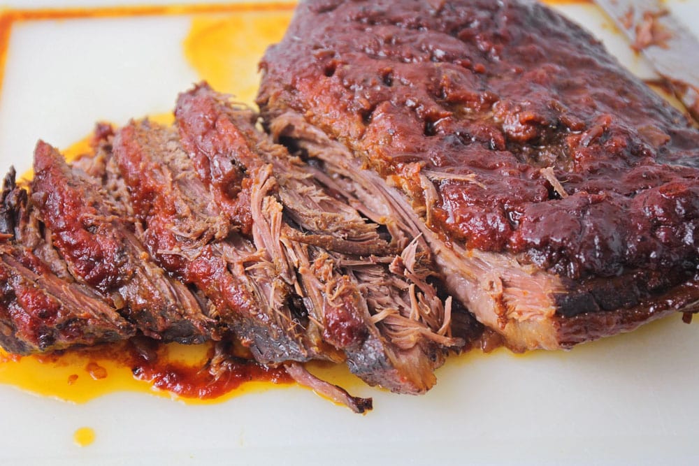 Beef brisket sliced on a cutting board