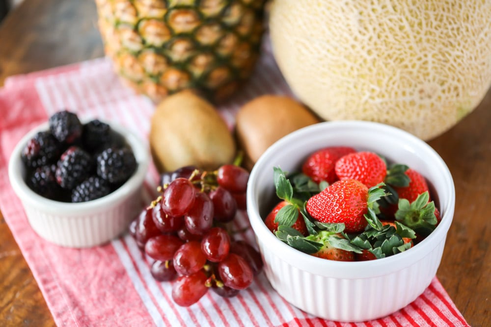 Several types of fruit on a kitchen table.