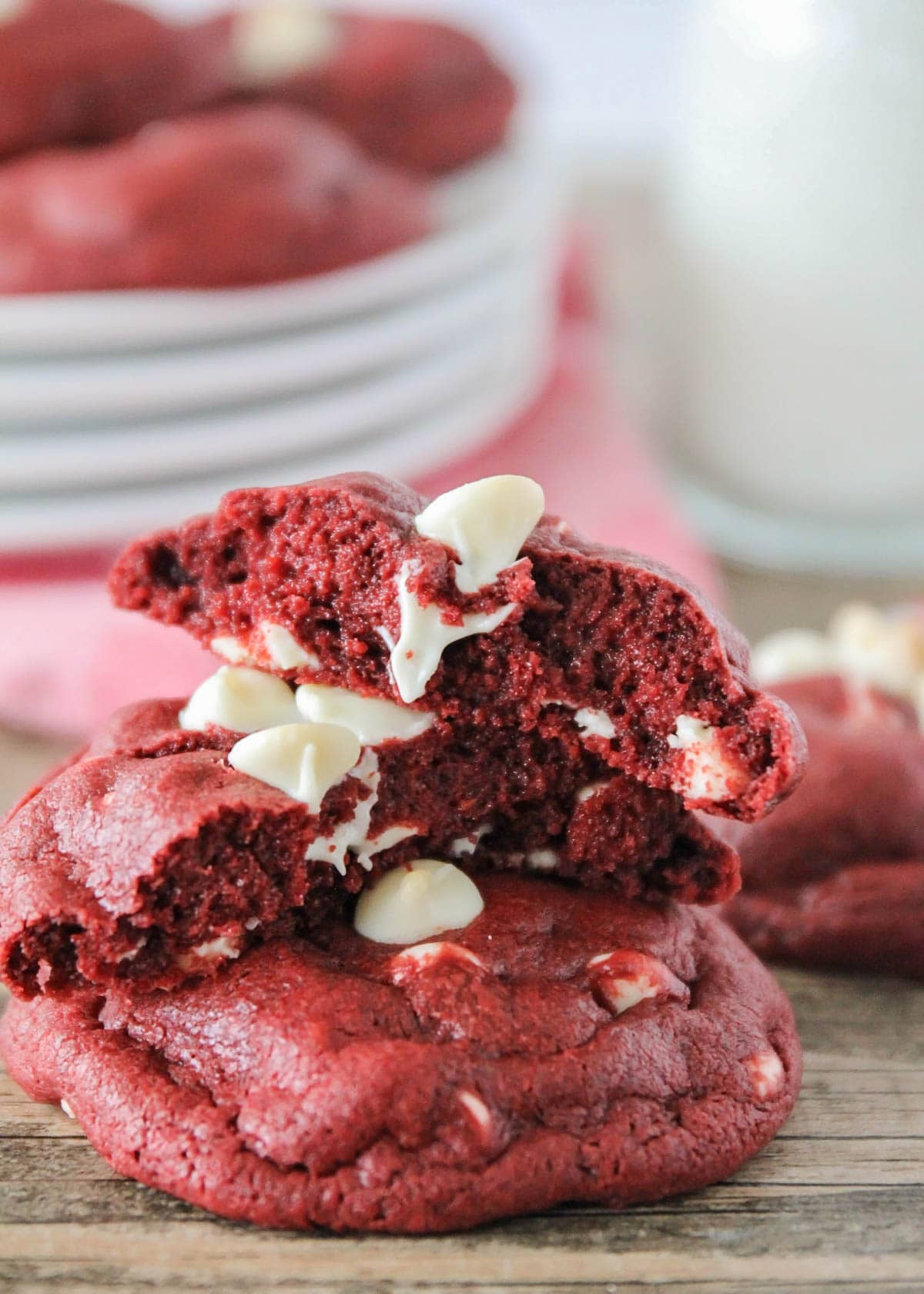 A red velvet white chocolate chip cookie split in half