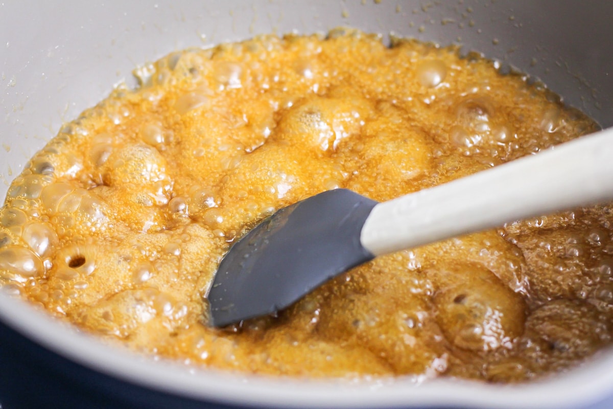 Cooking sugar in a pot.