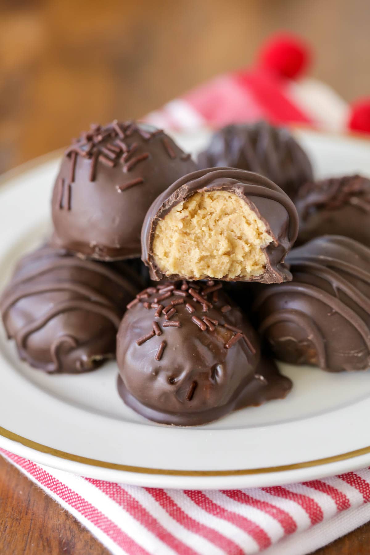 No bake peanut butter balls recipe on a white plate.