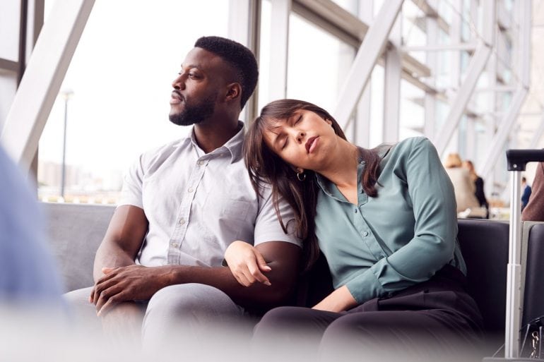 Tired couple waiting at the airport