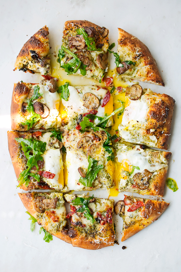 Breakfast Pizza with Basil Pesto and Sun-Dried Tomatoes - a simple breakfast pizza that's topped with fresh eggs and it's so good! #breakfast #breakfastpizza #pizza #pizzanight | Littlespicejar.com