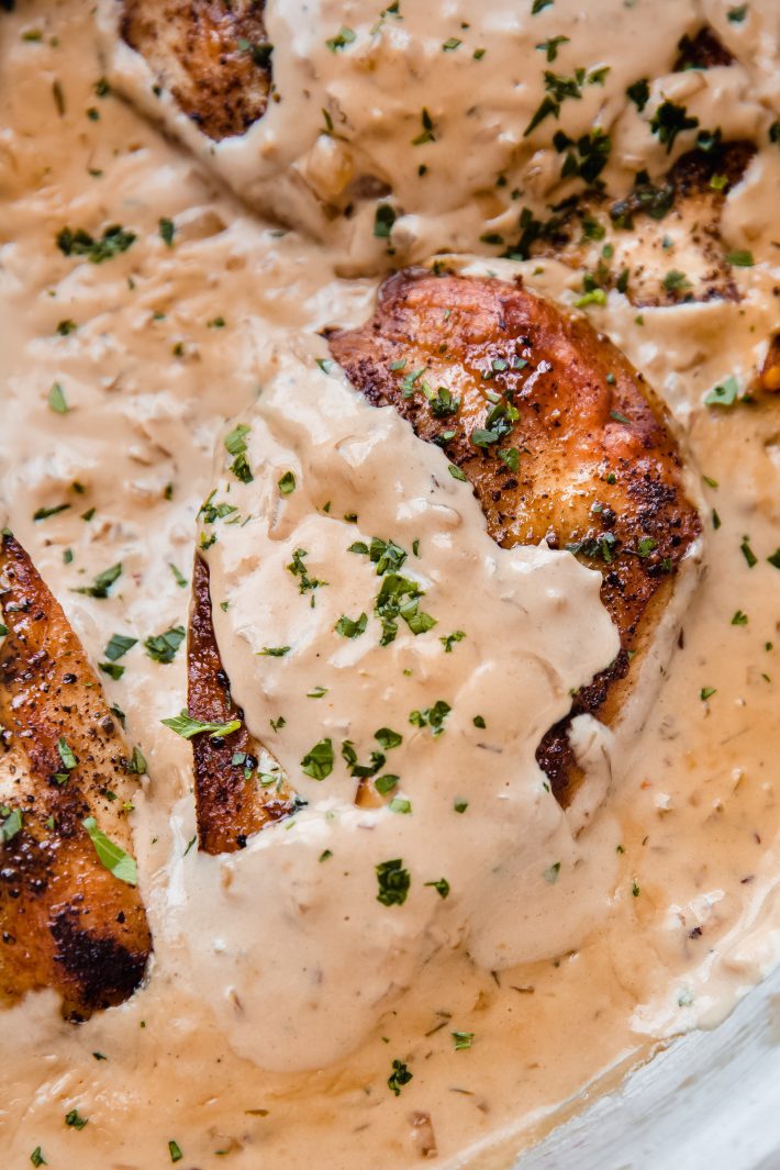 close up of chicken breast in balsamic onion cream sauce