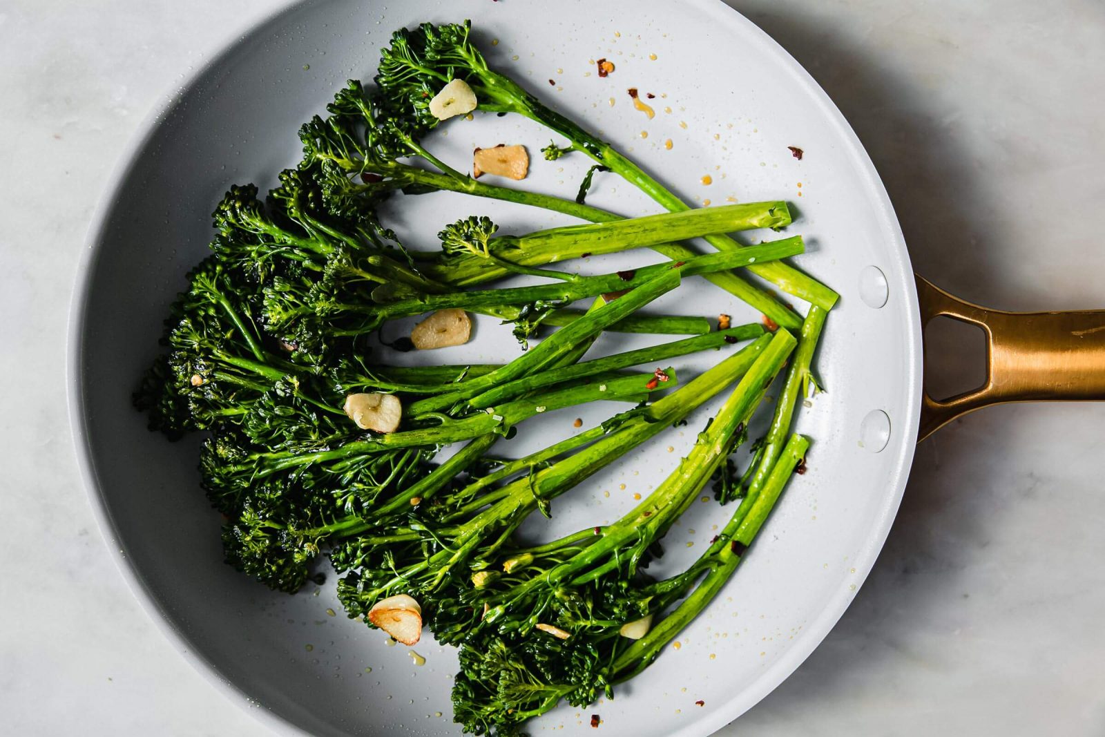 Broccolini in a skillet.