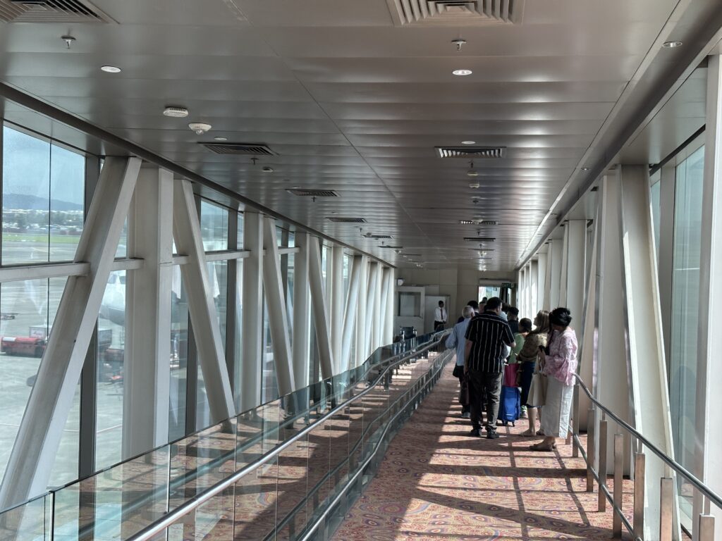 a group of people walking down a walkway