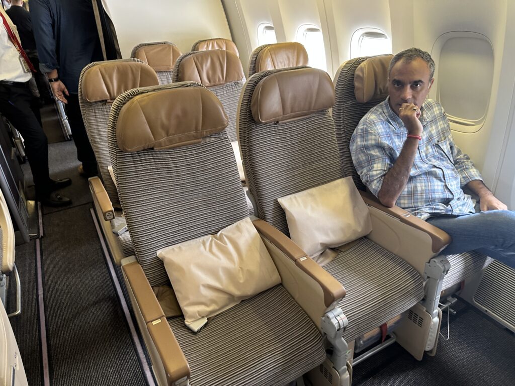 a man sitting in an airplane seat