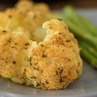 This delicious Ranch Whole Roasted Cauliflower recipe has only 3 ingredients and is super easy to make. The perfect low-carb side dish for lunch or dinner.