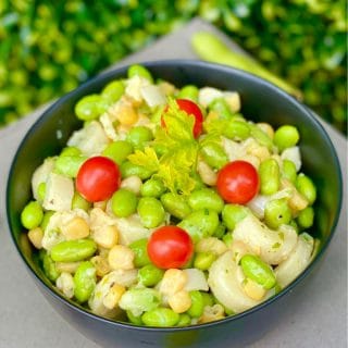 This fresh Hearts of Palm Edamame Salad has corn, cilantro, and is drizzled with an easy dijon dressing. The perfect healthy salad for any occasion.