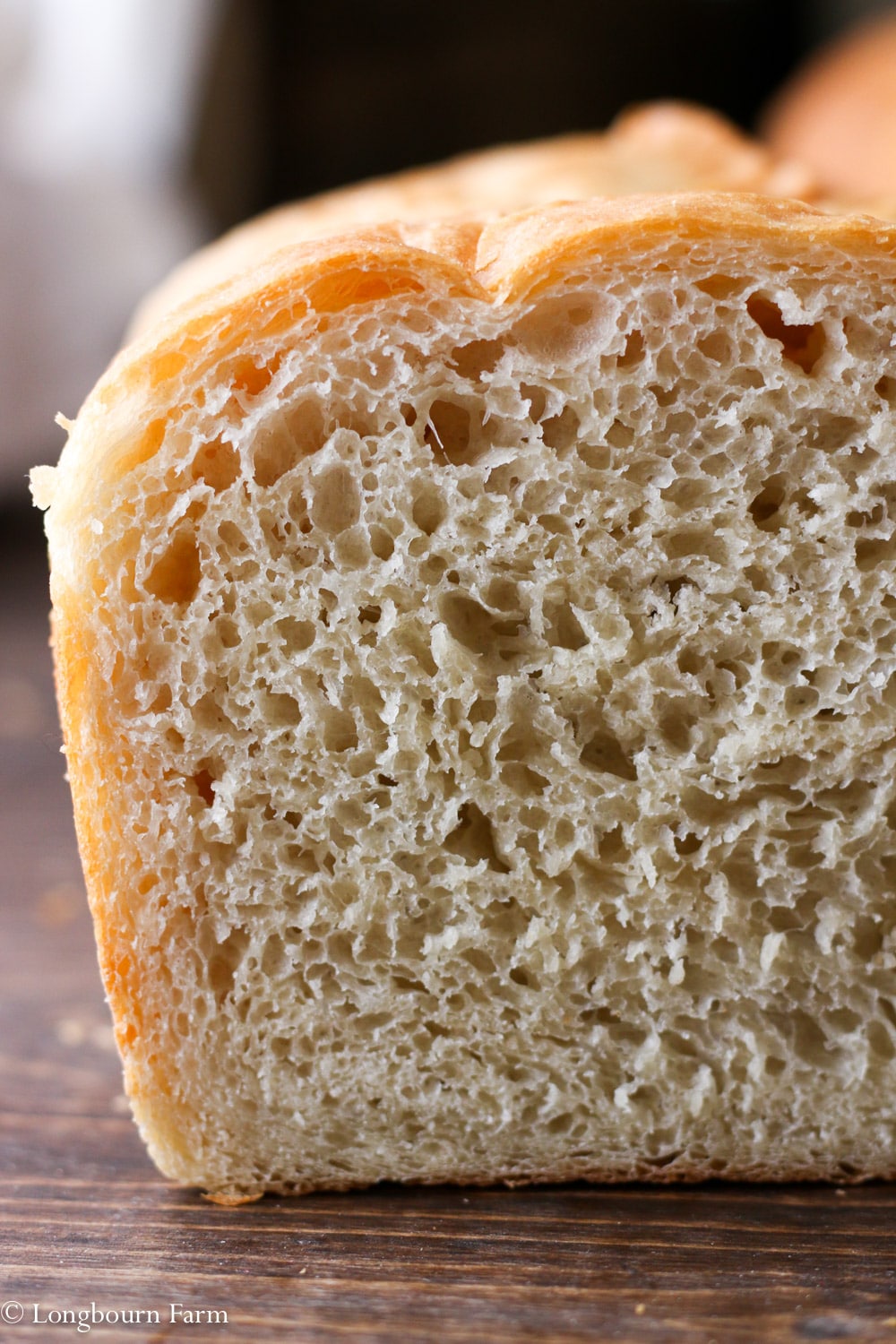 Front view of a sliced loaf of the best homemade bread recipe.