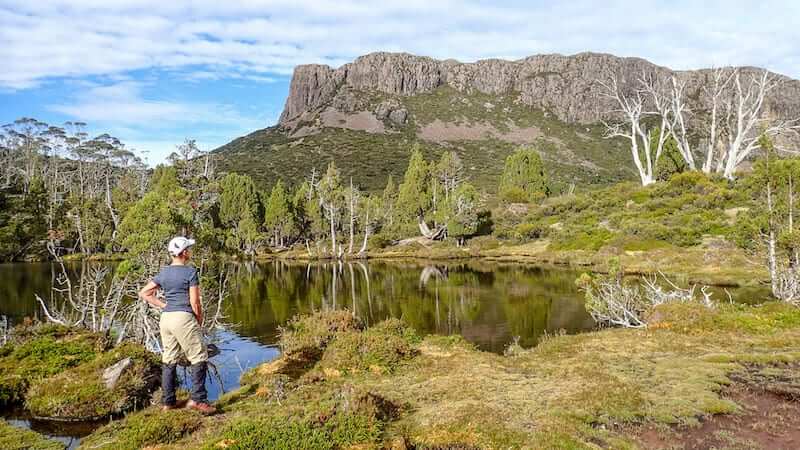 Woman stands beside Pool of Siloam in Walls of Jerusalem National Park