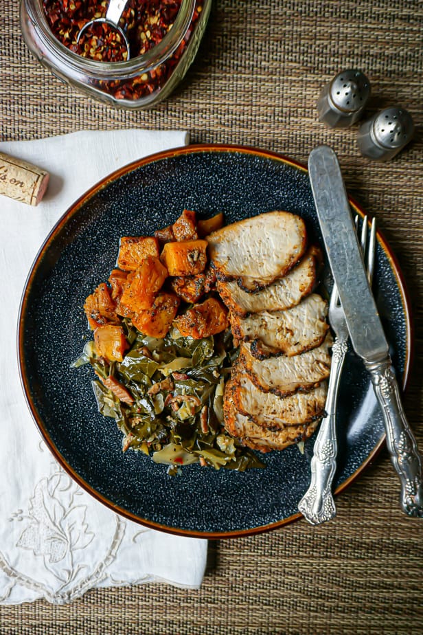 dinner plate of butternut squash, collards, and pork tenderloin