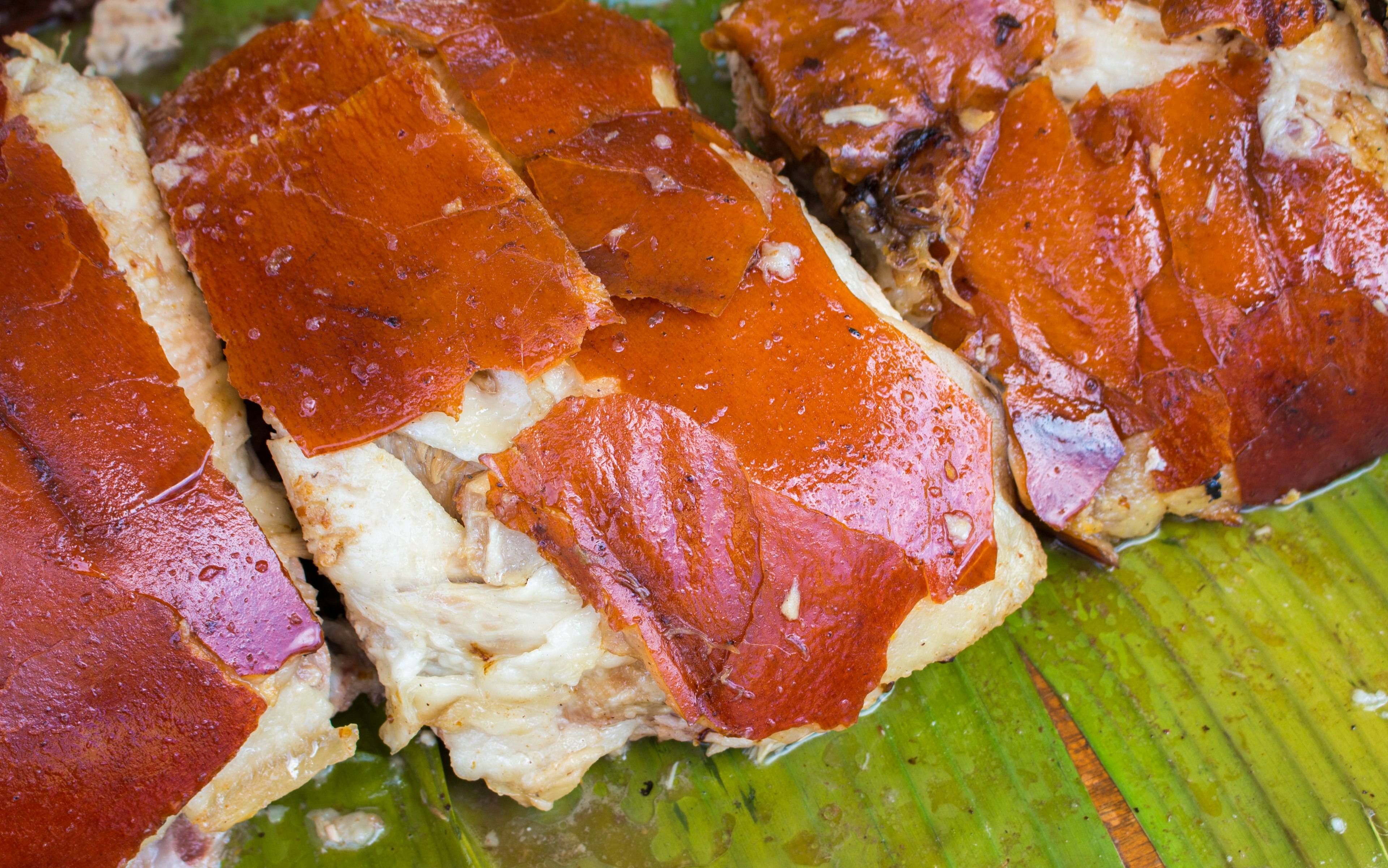 Juicy pork meat cooked for lunch. Sliced pork barbecue with pink meat.