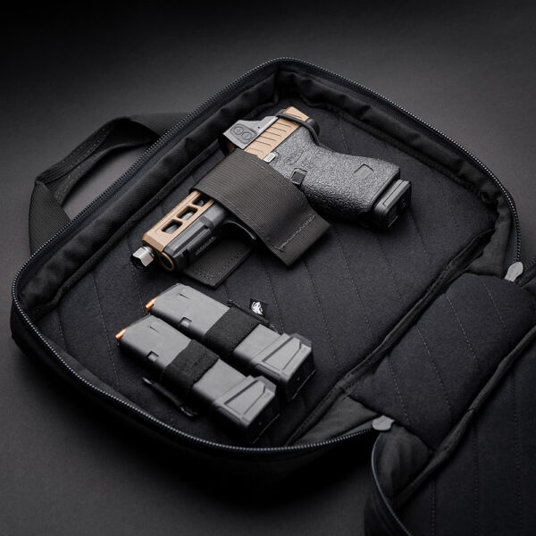 The Prime Pistol Bag Holding a Glock and two magazines