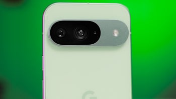 The Pixel 9 on a green background.