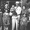 Eugene Hoo, Grace Lem, Helen Quan, Sidney Toler, Layne Tom Jr., Barbara Jean Wong, Iris Wong, Victor Sen Yung, Faye Lee, David Dong, Allan Hoo, Sinclair Yip, Grace Key, Margie Lee, Florence Ung, Frances Hoo, and Hippie Hoo in Charlie Chan in Honolulu (1938)