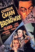 Louise Henry, Joan Marsh, and Warner Oland in Charlie Chan on Broadway (1937)